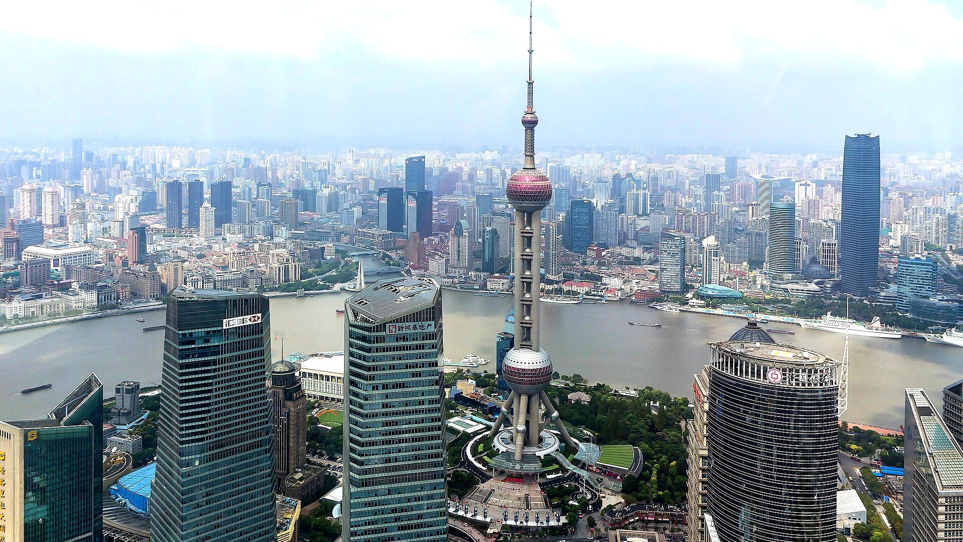 Daytime view over a commercial city district and river